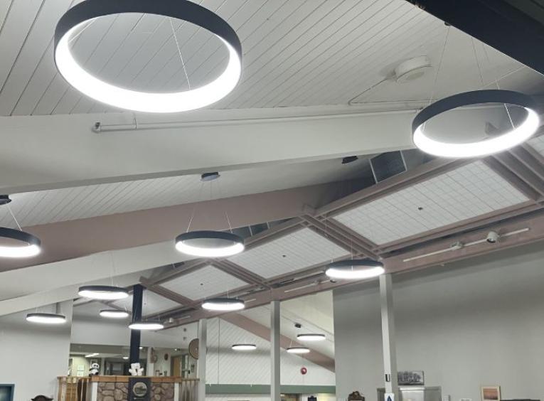 Circular LED lights hang from the ceiling of Dunrovin Park Lodge