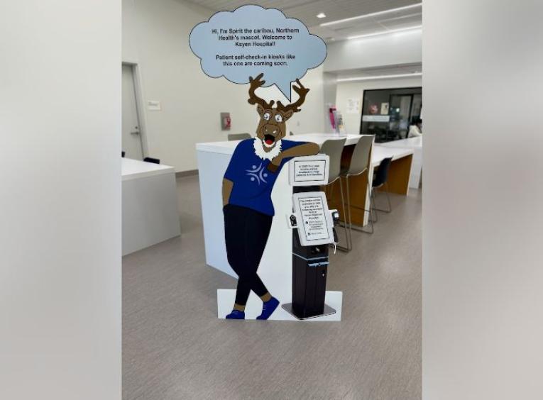 A cardboard cut out of Sprit the caribou from inside Ksyen Regional Hospital. 