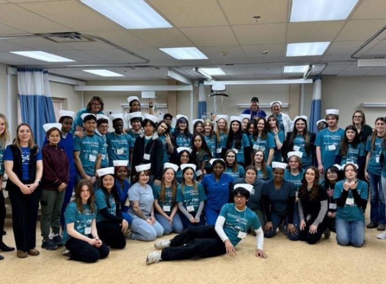 All participants in the 2025 Adventures in Healthcare: Peace Region posed for a group photo on the first day of the event