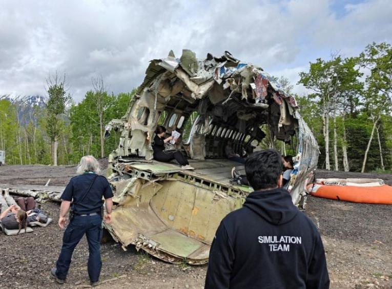 BC first responders walk toward a simulated plane crash