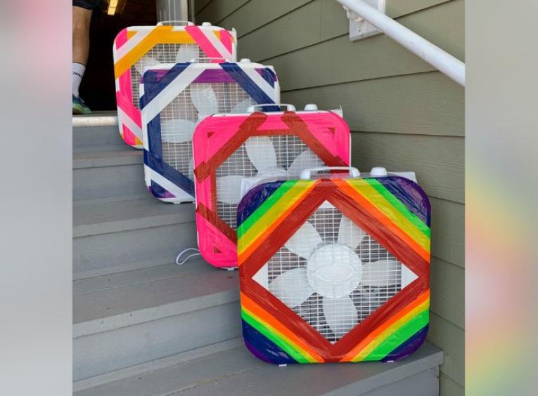 Multi-coloured DIY air filters placed on a set of grey steps