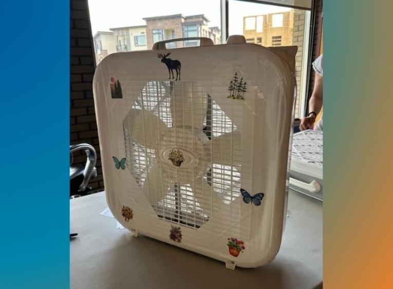 Fan repurposed into an air cleaner with tape and a furnace filter.