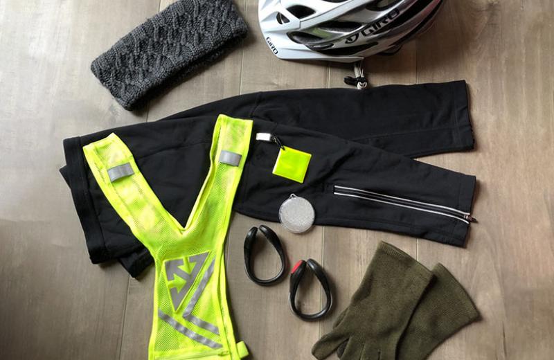 Fall biking gear, like pants, a high-visibility vest, helmet, and gloves.