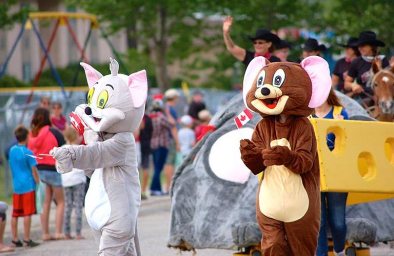 Parade with brown mouse and grey cat mascot