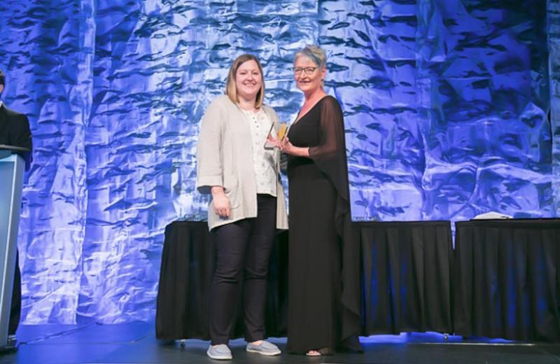 Tamara Reichert accepting an Award of Excellence at the IABC Awards.