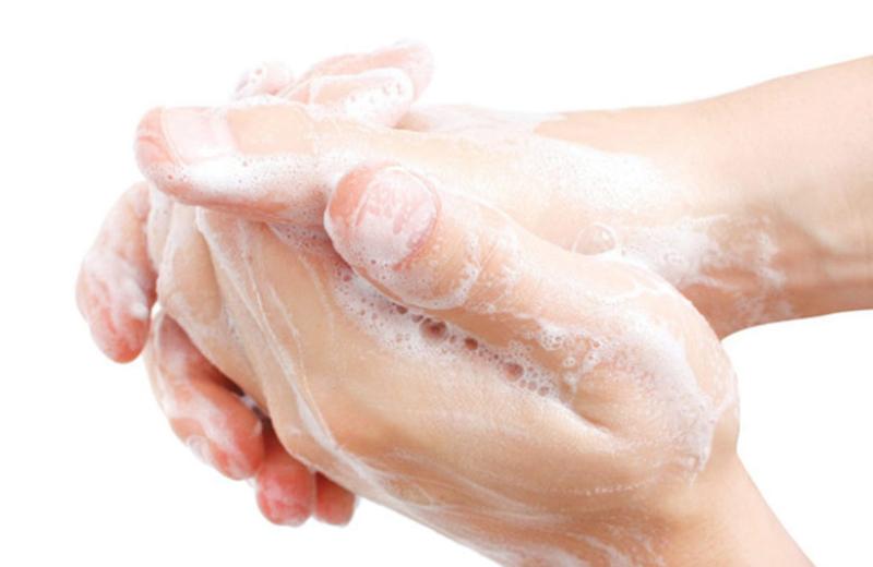 Hands washing with soap.