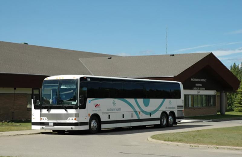 An NH Connections bus parked out front of the Mackenzie & District Hospital & Health Centre.
