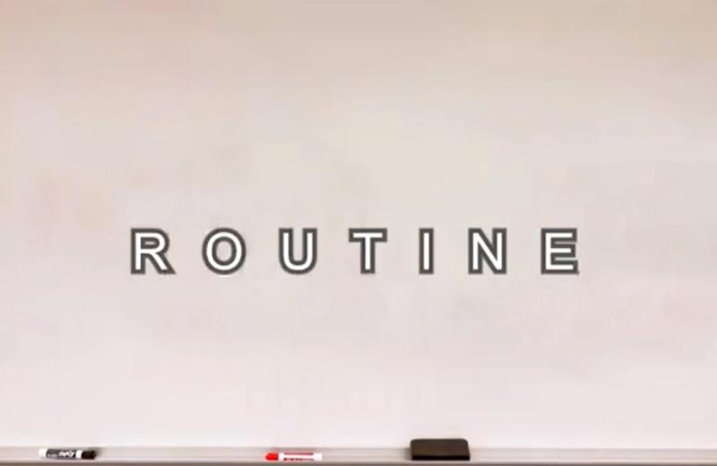A whiteboard with the word Routine on it.