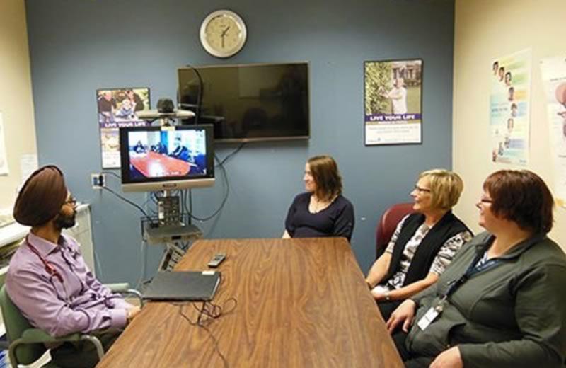 Healthcare professionals in a telehealth meeting.