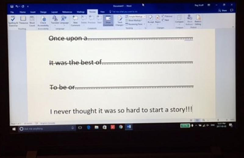 Laptop screen with opening story sentences crossed out.