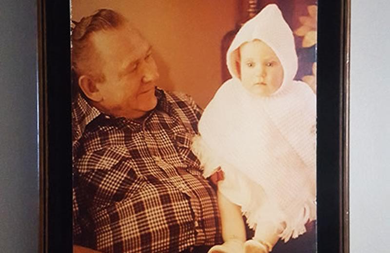 little girl sitting on grandpa's lap