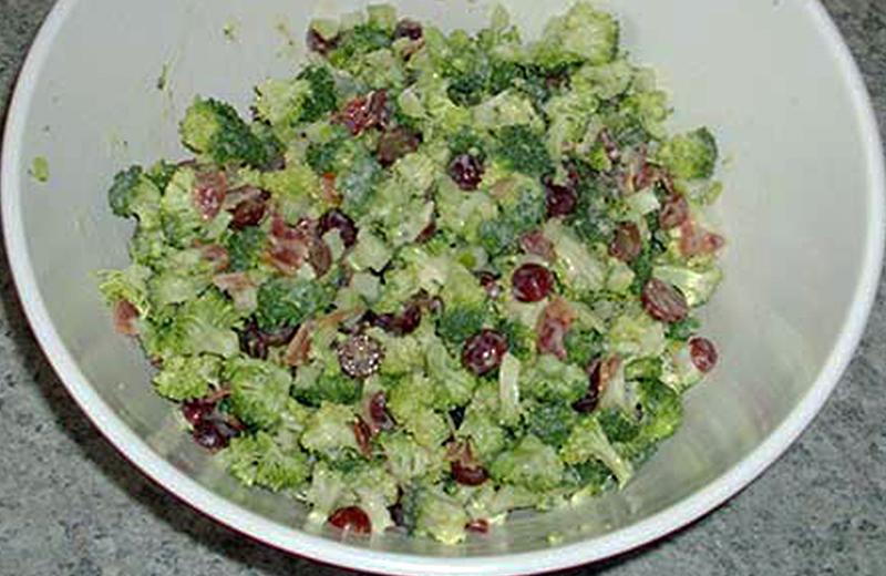 Fresh broccoli salad in a white bowl