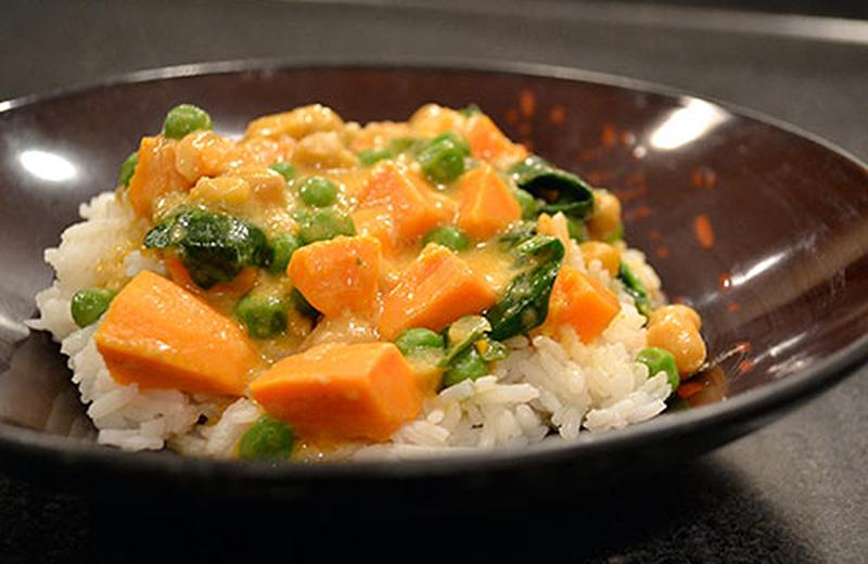 Chickpea curry on rice in a brown bowl