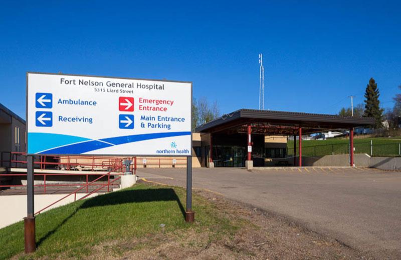 Front entrance of the Fort Nelson hospital and sign