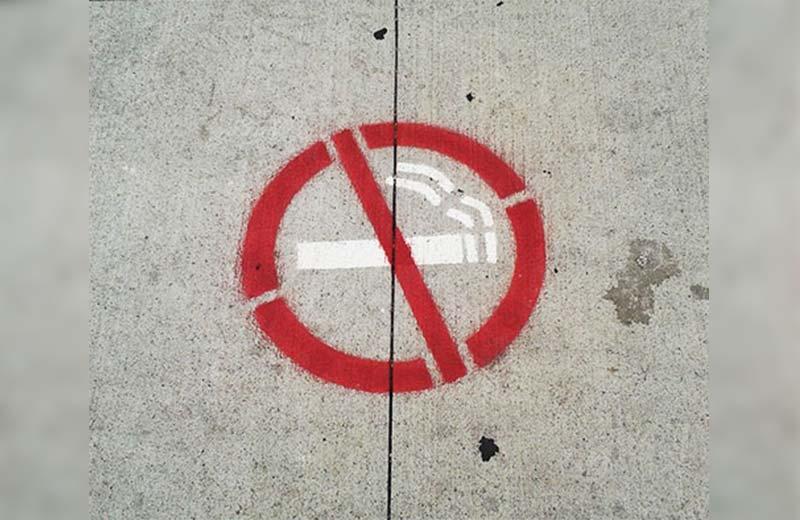 No smoking symbol on pavement.