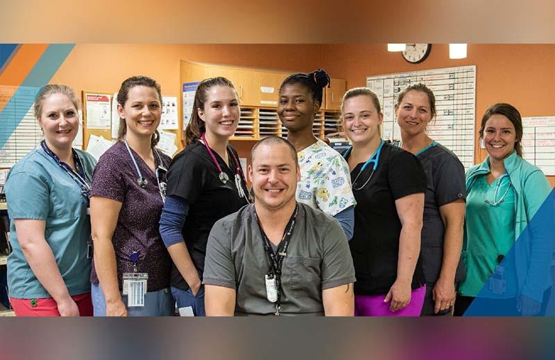 a group shot of health care workers in scrubs