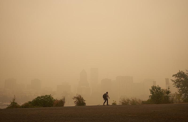 person walking in smoky conditions