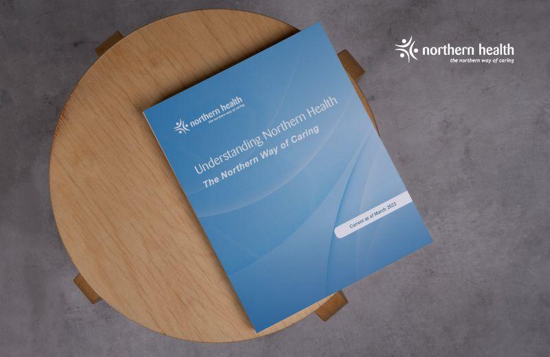 Northern Health's handbook " Understanding Northern Health" on a table