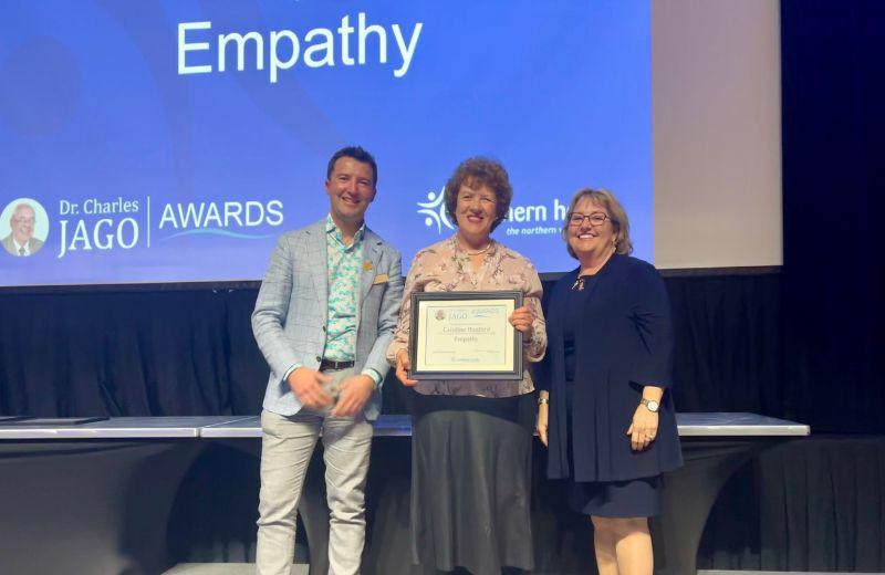 Ciro Panessa, President & CEO, Colleen Nyce, Board Chair, and Caroline Dunford, Occupational Therapist pose with her award