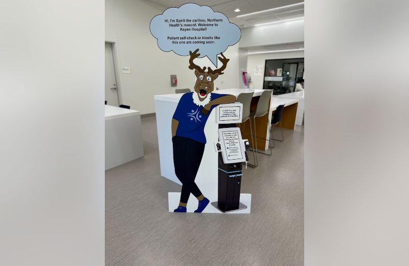 A cardboard cut out of Sprit the caribou from inside Ksyen Regional Hospital. 