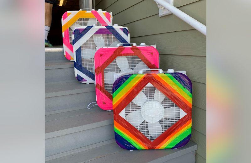 Multi-coloured DIY air filters placed on a set of grey steps
