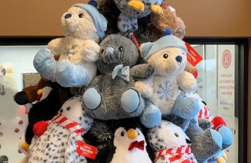 PetSmart tree display with stuffed animals.