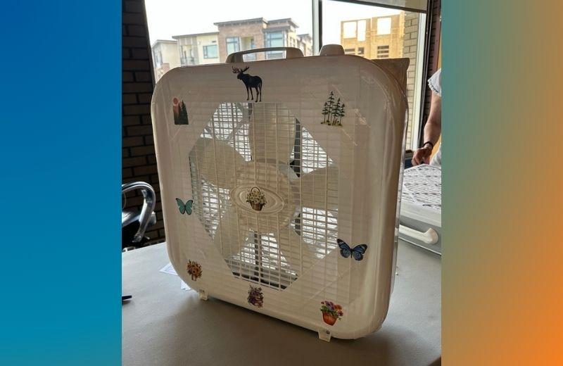 Fan repurposed into an air cleaner with tape and a furnace filter.