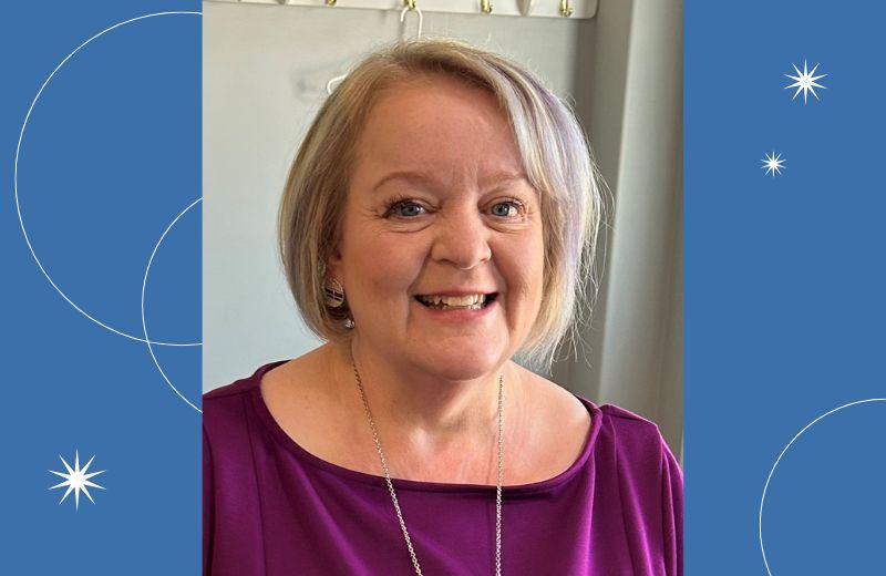 Older woman with short grey blonde hair. 