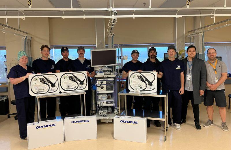 Sharon Stromdahl of the Prince Rupert Talent Cancer Auction Group, Rupert Rampage players Reid Lindsay, Tyler Ostrom, Jacob Santurbano, Marcus Atchison, Judd Repole, Kory Movold and Northern Health employees Ivan Urcia (Operating Room Manager), and Jesse Sales (Director of Care) show off the new scopes.  