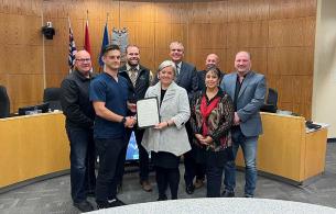 Mayor and councillors present proclamation for MRT week.