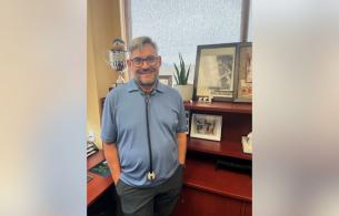 Dr. Strydom standing in his office