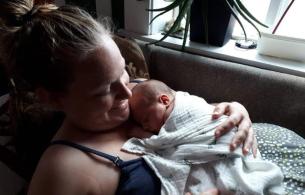 Emma holding Soren on her chest at two days old