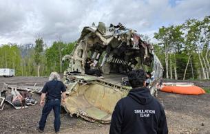 BC first responders walk toward a simulated plane crash