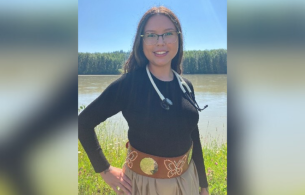 Nurse standing by river.
